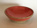 red ceramic bowl with speckled clay.